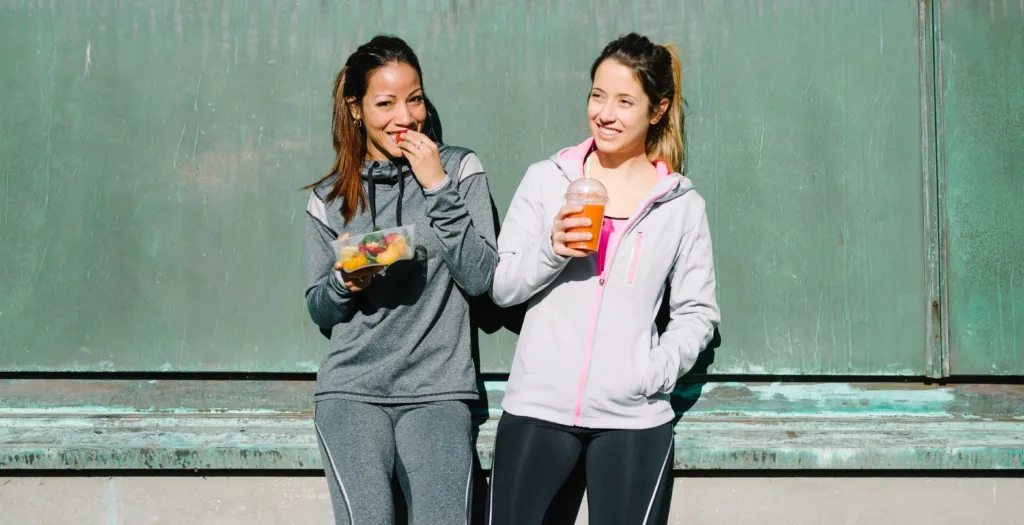 Women post workout rehydrating